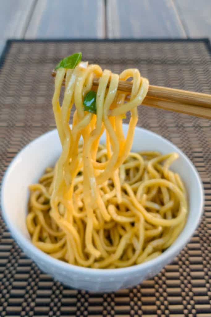 garlic noodles on chopsticks