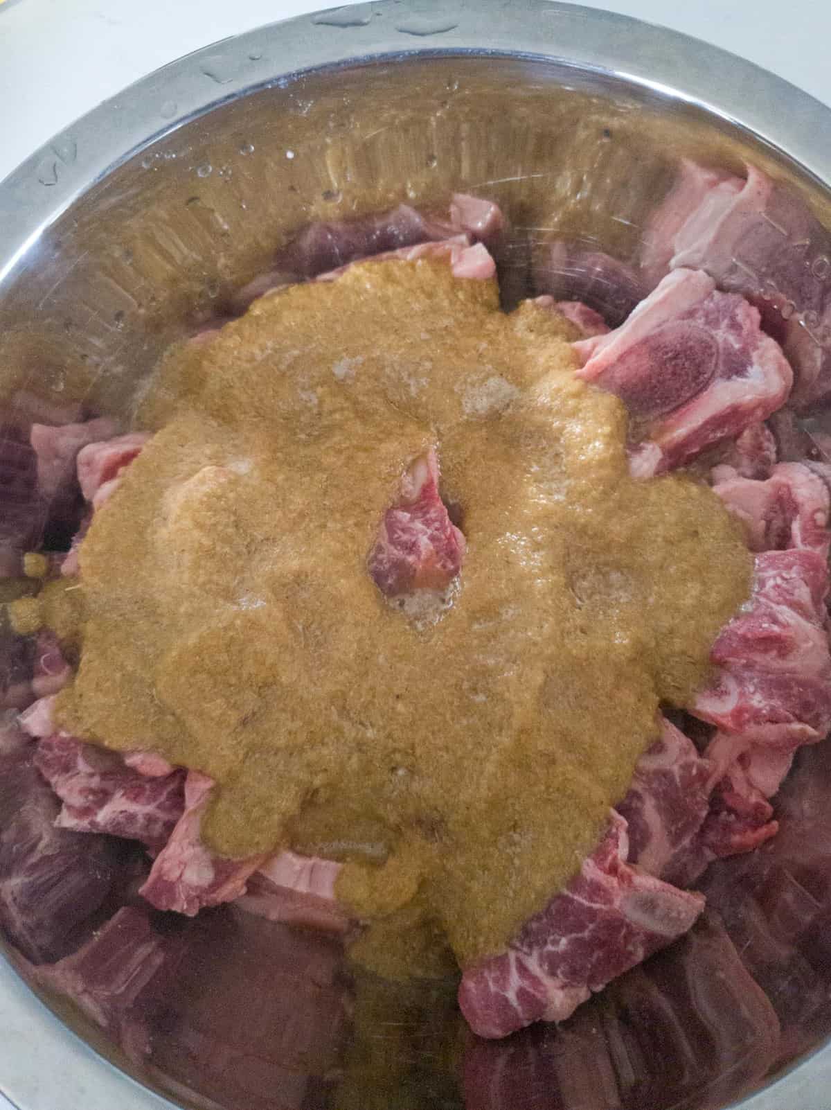 marinade in a bowl with short ribs